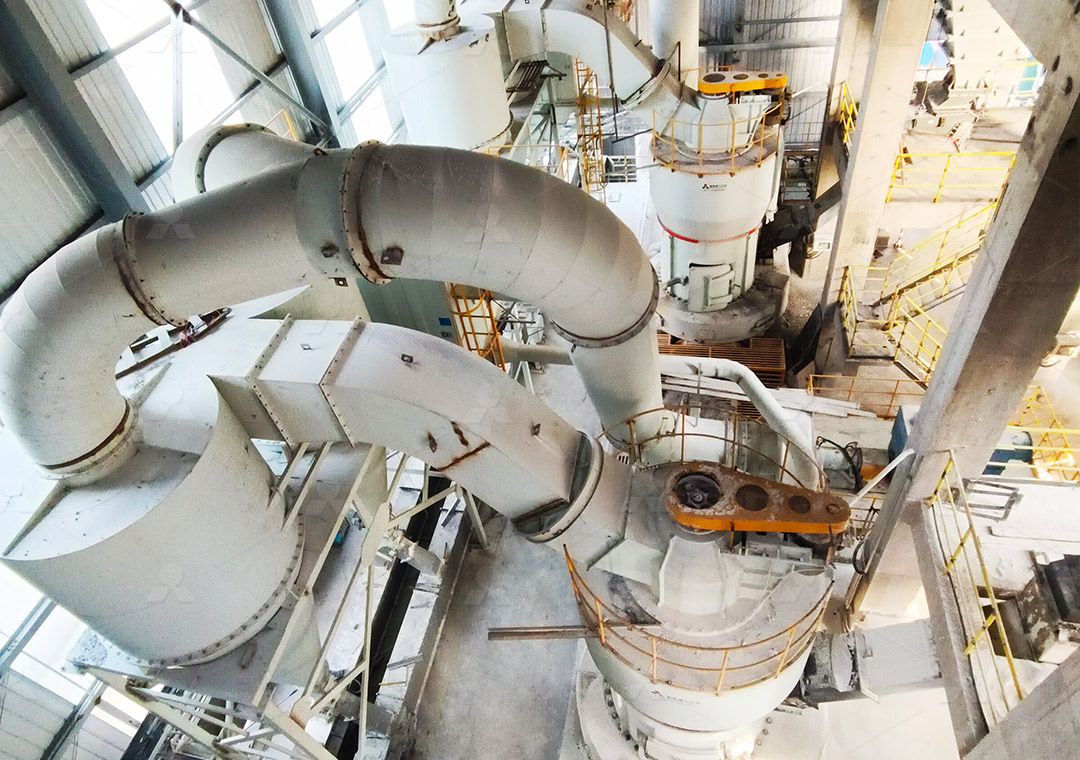 Technician performing maintenance check on grinding rollers